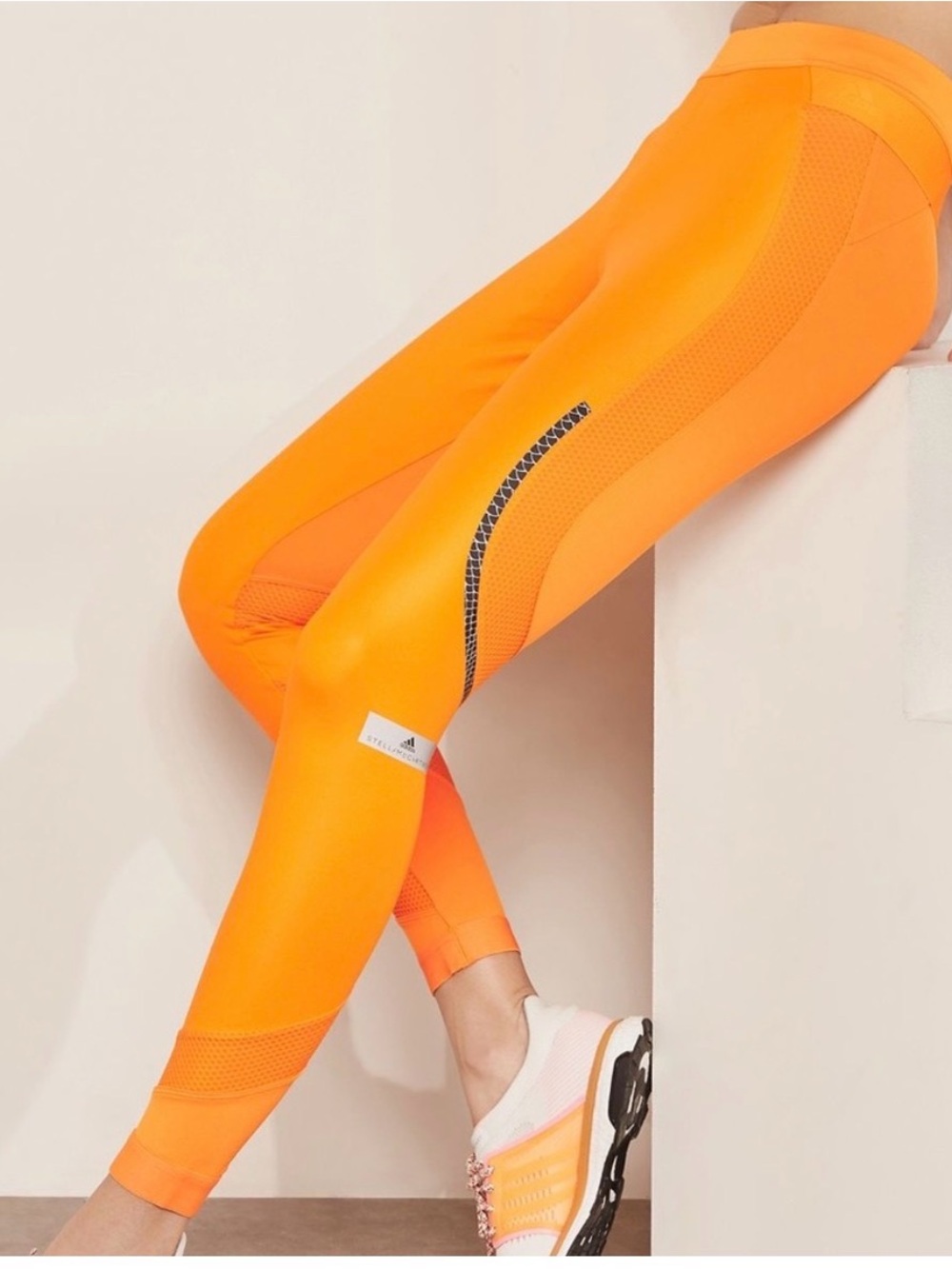 Adidas by Stella McCartney orange running tights with reflective details